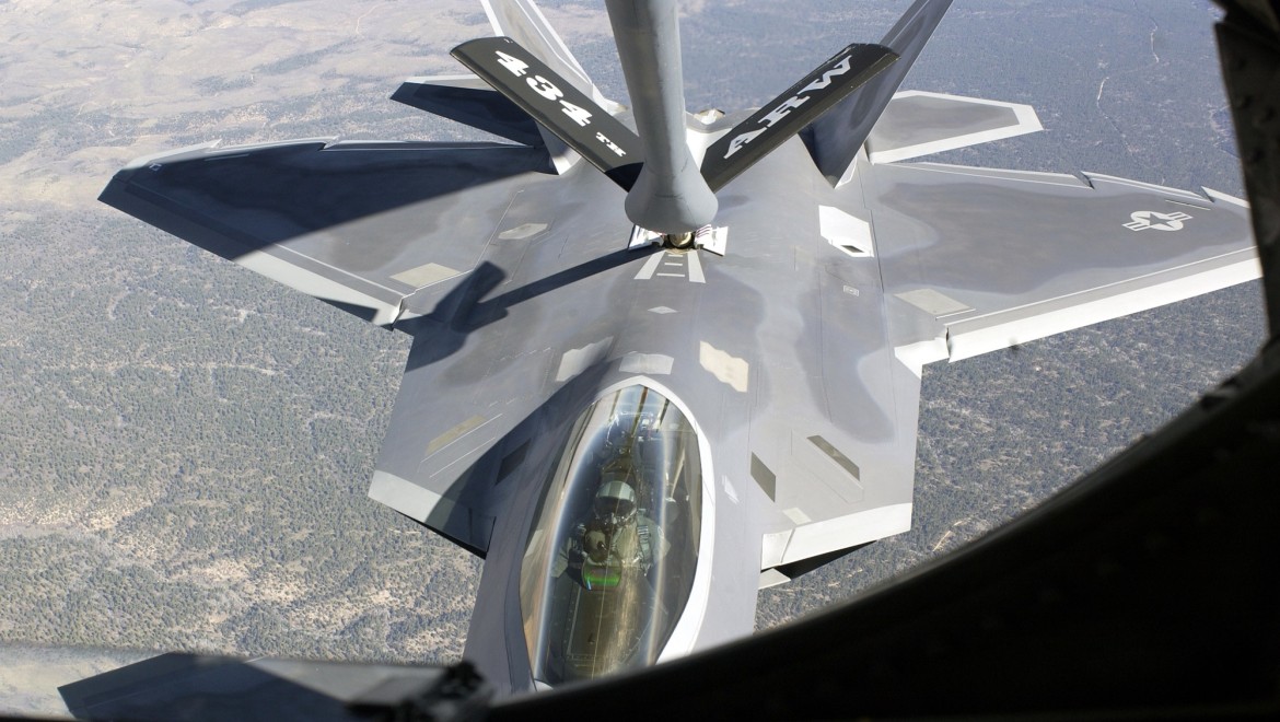 Nellis Air Force Base, Nev. -- An F/A-22 Raptor is refueled by a KC-135 Stratotanker over the Grand Canyon National Park. The Air Warfare Center is playing a major role in the Initial Operational Test and Evaluation of the aircraft. (U.S. Air Force photo)